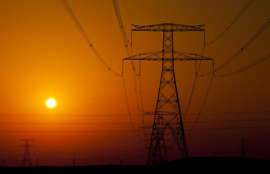 powerlines in a smokey sunset